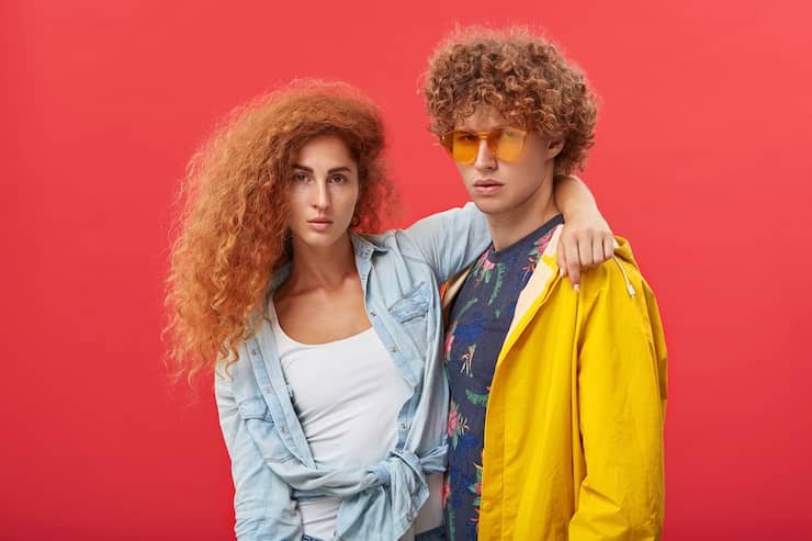 Smiling couple with ginger hair embracing